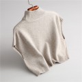 Wearing a low necked small stature with a high necked knitted pullover