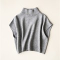 Wearing a low necked small stature with a high necked knitted pullover