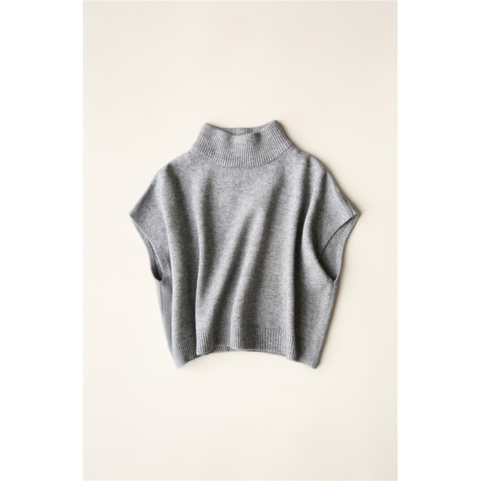 Wearing a low necked small stature with a high necked knitted pullover